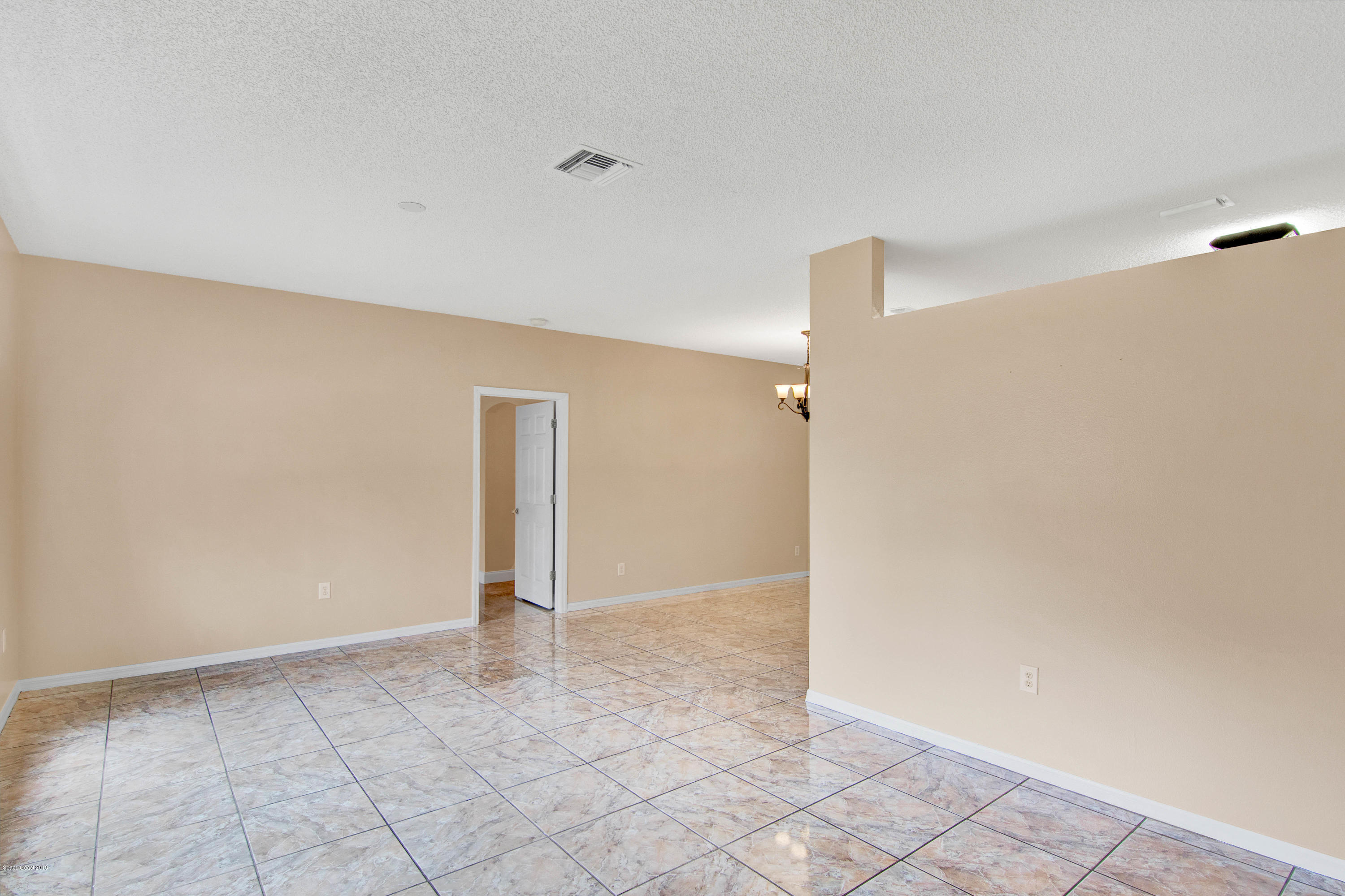 1030 Meadowbrook Road Northeast Palm Bay, FL 32905 - Photo 6 of 24 a view of an empty room