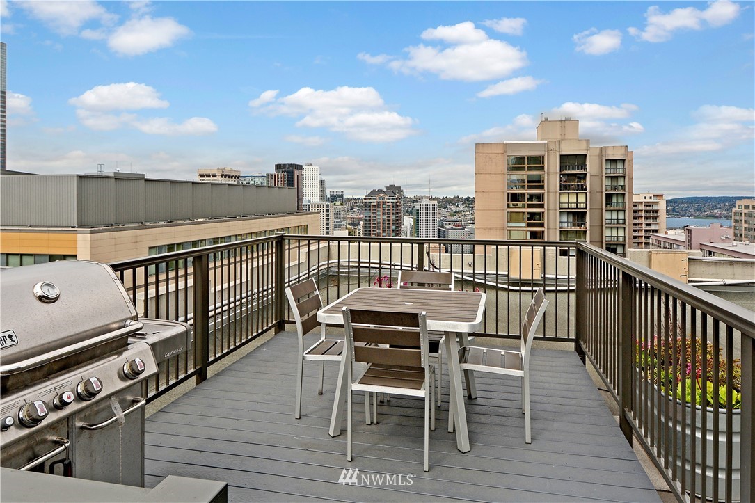 1105 Spring Street, Unit 610 Seattle, WA 98104 - Photo 11 of 12 a view of a balcony with wooden floor