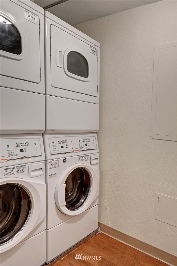 1105 Spring Street, Unit 610 Seattle, WA 98104 - Photo 10 of 12 a utility room with dryer and washer