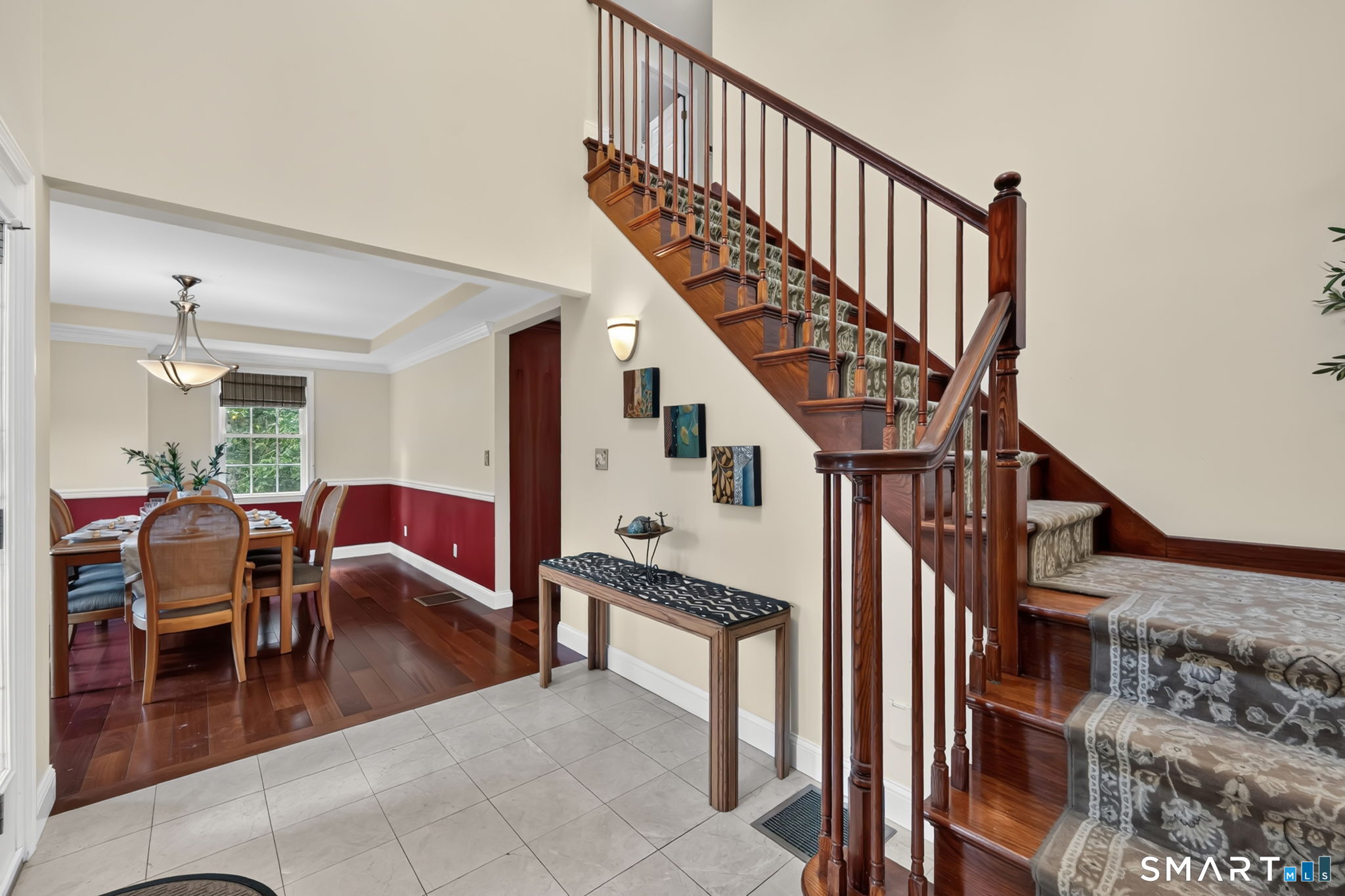 5 Edwards Way Bloomfield, CT 06002 - Photo 9 of 40 The dramatic double-height foyer is perfect for displaying artwork and welcoming guests. The formal dining room can be seen on the left.