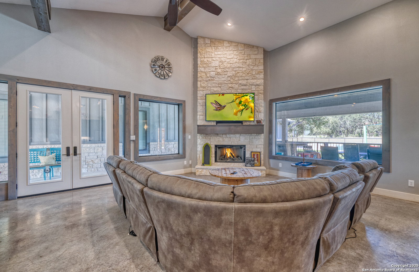 989 Mountain Valley Road Concan, TX 78838 - Photo 11 of 35 a dining room with furniture and a floor to ceiling window