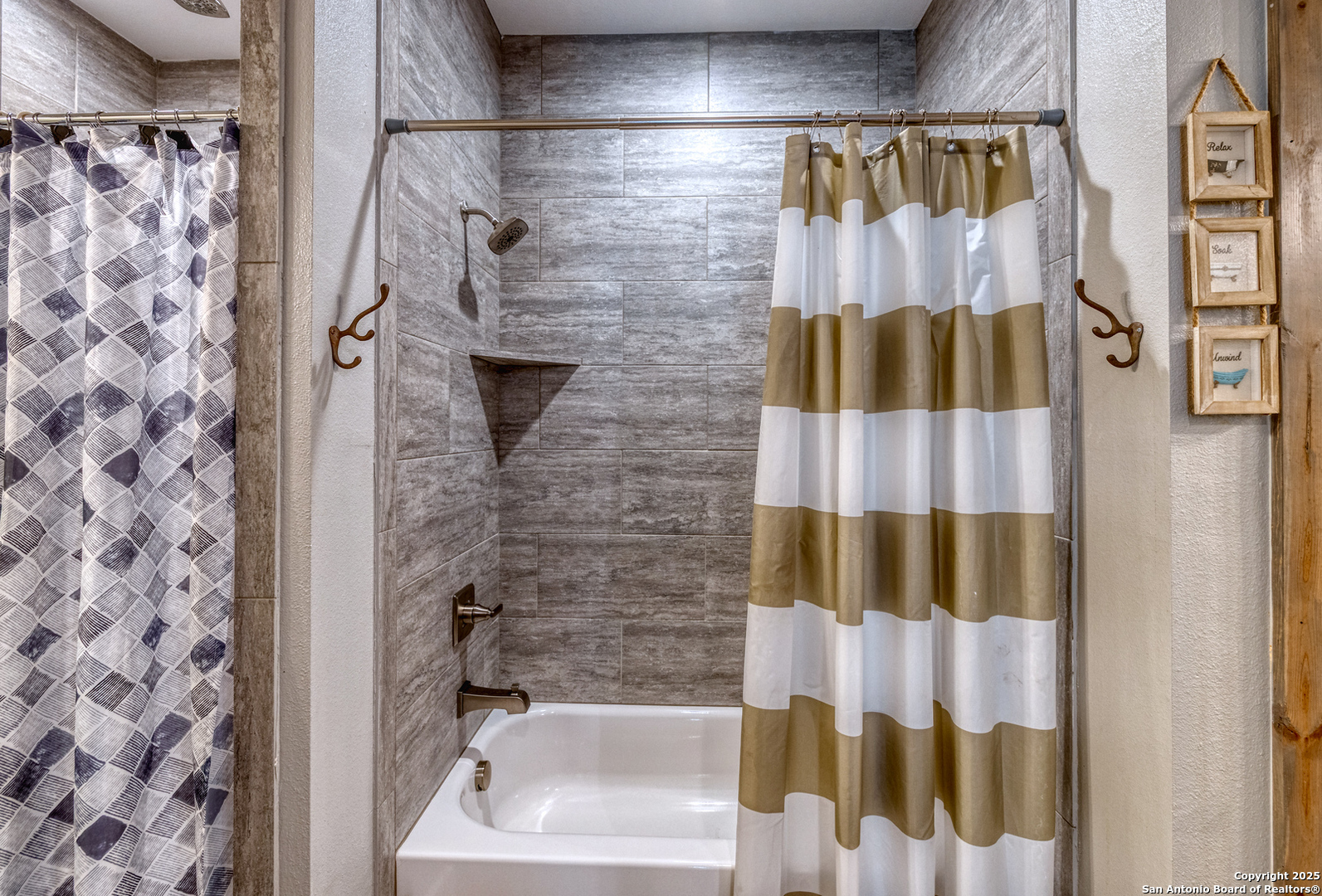 989 Mountain Valley Road Concan, TX 78838 - Photo 16 of 35 a bathroom with a shower curtain