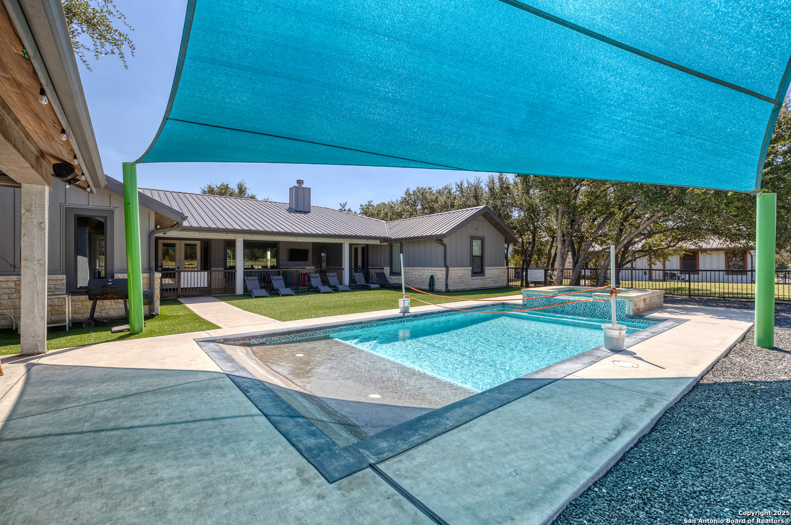 989 Mountain Valley Road Concan, TX 78838 - Photo 31 of 35 a view of swimming pool with an outdoor seating