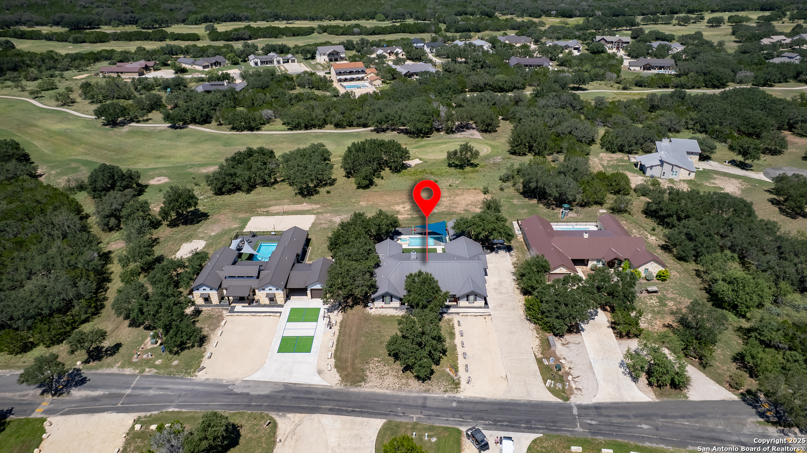 989 Mountain Valley Road Concan, TX 78838 - Photo 33 of 35 an aerial view of house with yard