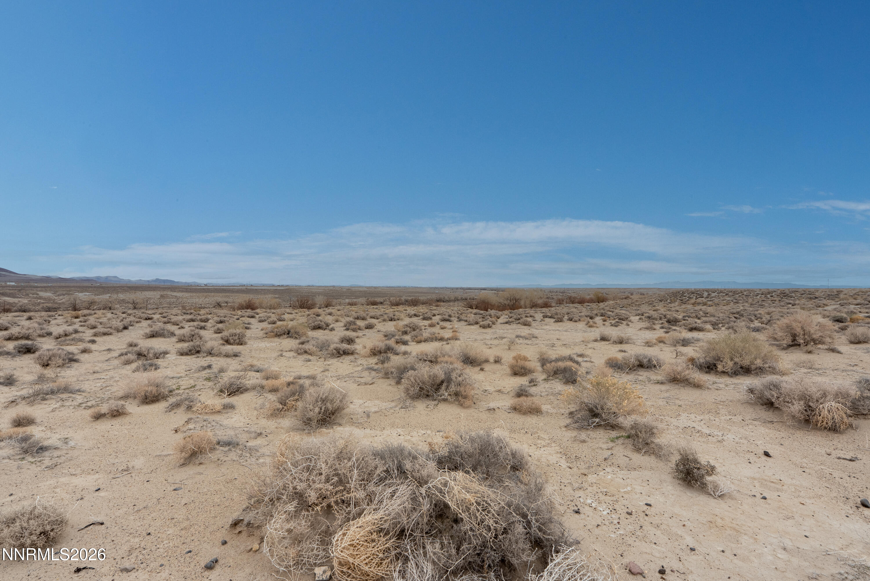 17001 Lahontan Dam Road Fallon, NV 89406 - Photo 32 of 38 a view of a dry yard with wooden floor and fence