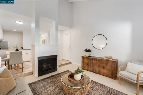 a living room with furniture a fireplace and a fireplace