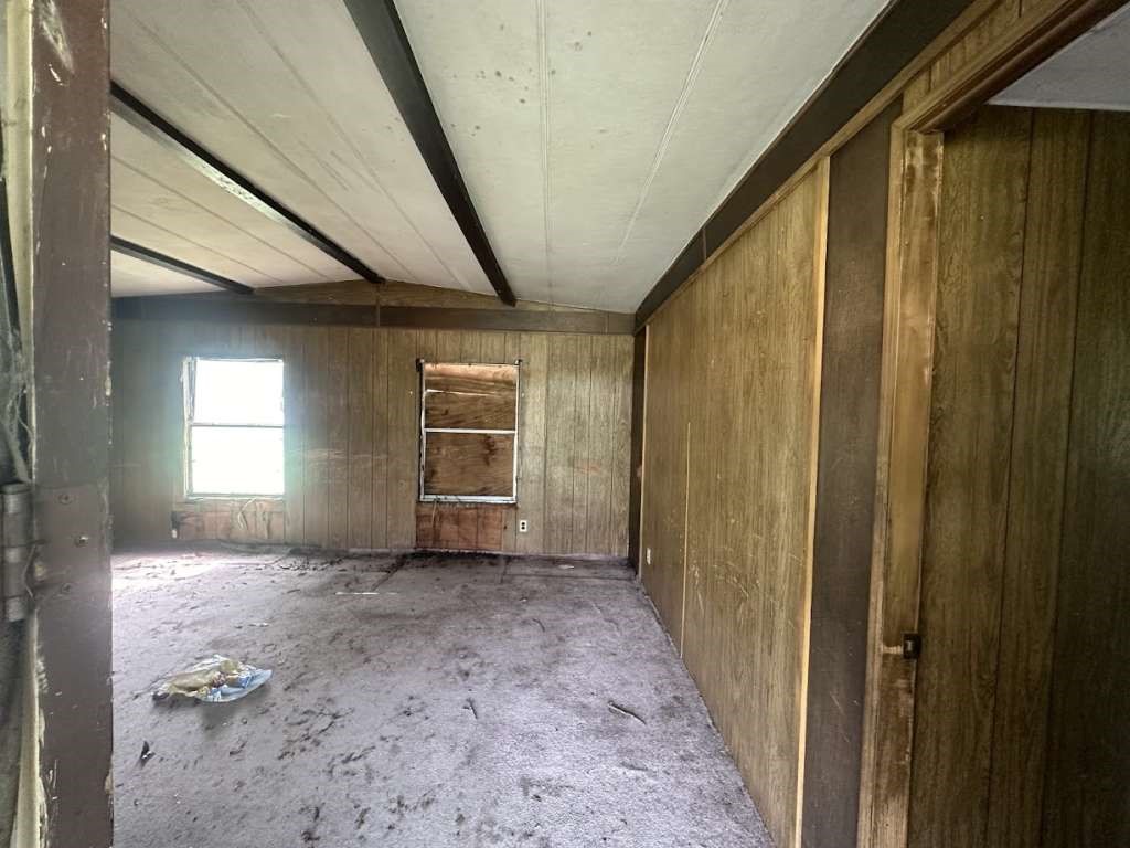 602 East Navasota Street Groesbeck, TX 76642 - Photo 10 of 13 a view of a livingroom with wooden floor and stairs