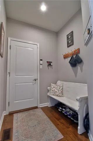 a view of workspace with furniture and wooden floor