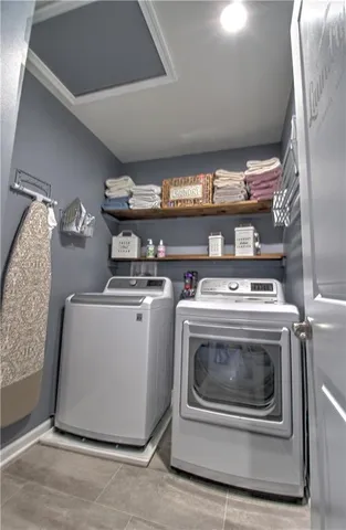 a utility room with washer and dryer