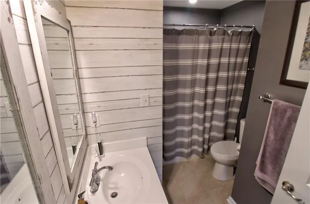 a bathroom with a sink and toilet