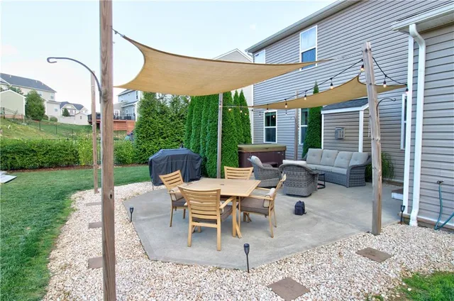 a view of a patio with couches chairs and a table
