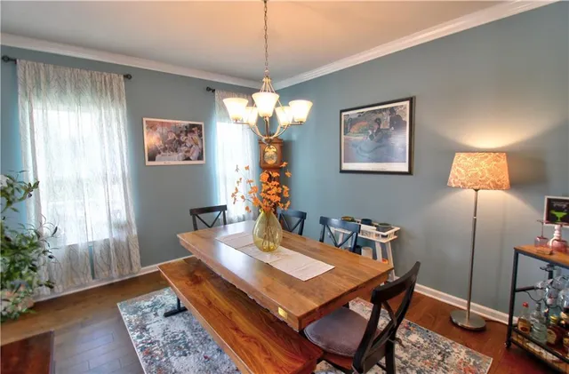 a dining room with a table and chairs