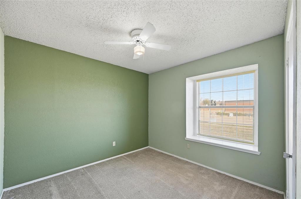 2708 Chisolm Trail Mesquite, TX 75150 - Photo 18 of 28 an empty room with a window and a fan