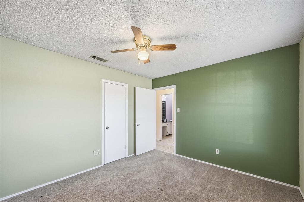 2708 Chisolm Trail Mesquite, TX 75150 - Photo 21 of 28 an empty room with closet and a ceiling fan