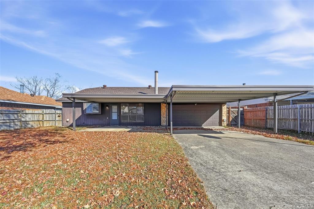 2708 Chisolm Trail Mesquite, TX 75150 - Photo 27 of 28 a front view of a house with garden