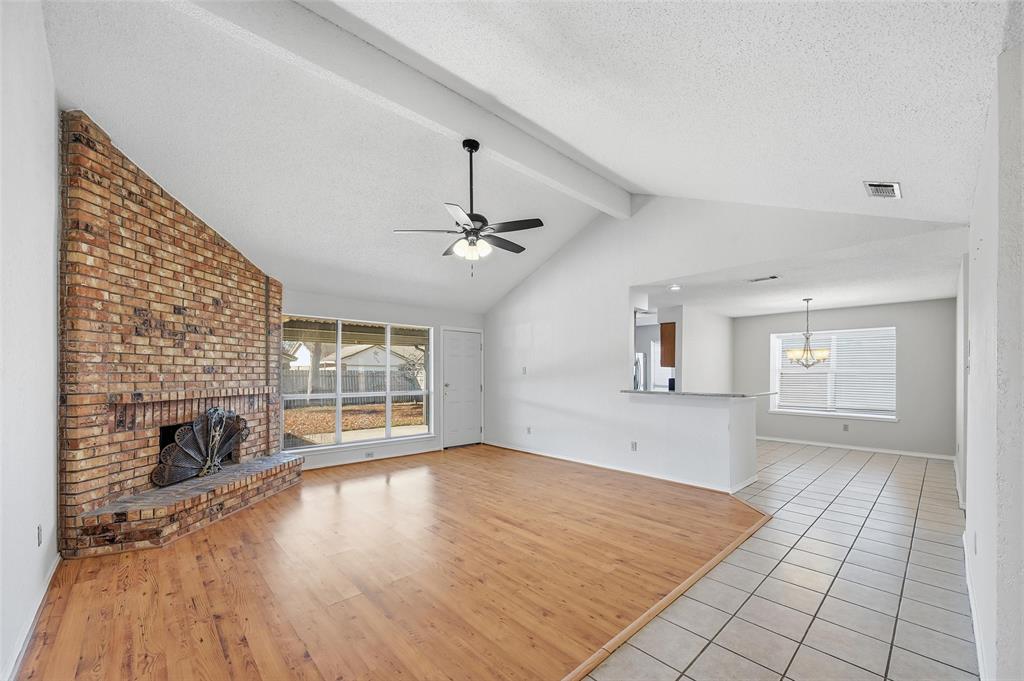 2708 Chisolm Trail Mesquite, TX 75150 - Photo 6 of 28 an empty room with windows and fireplace