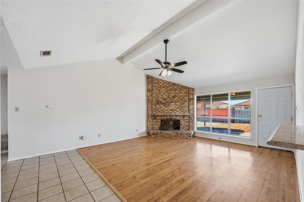 2708 Chisolm Trail Mesquite, TX 75150 - Photo 7 of 28 an empty room with windows and fireplace