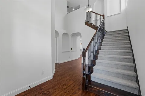 a view of entryway with wooden floor