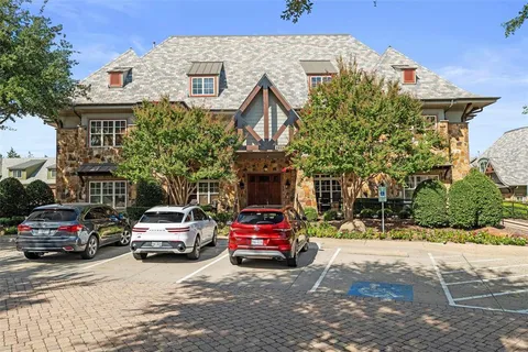 a view of a car parked in front of a house