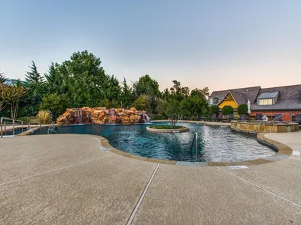 a view of swimming pool with a patio