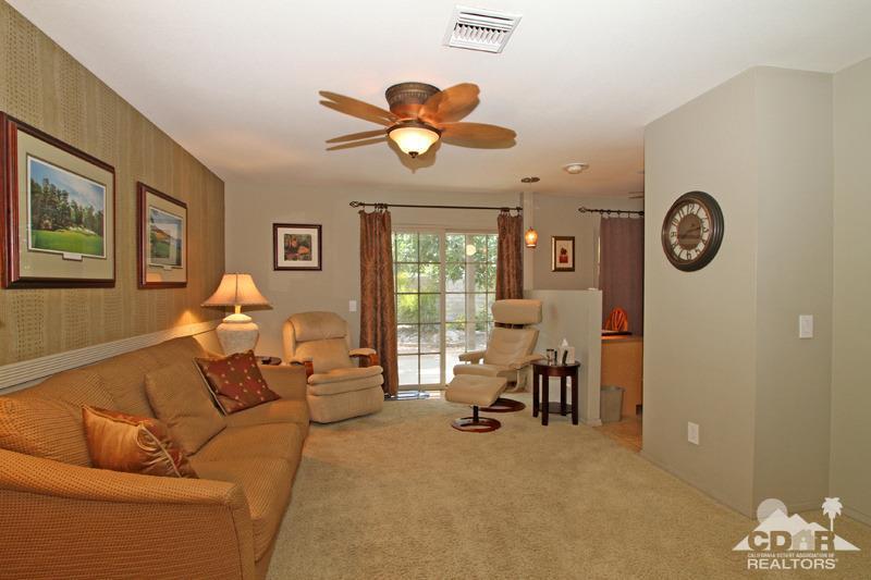 4 Kevin Lee Lane Rancho Mirage, CA 92270 - Photo 23 of 53 a living room with furniture a clock and a window