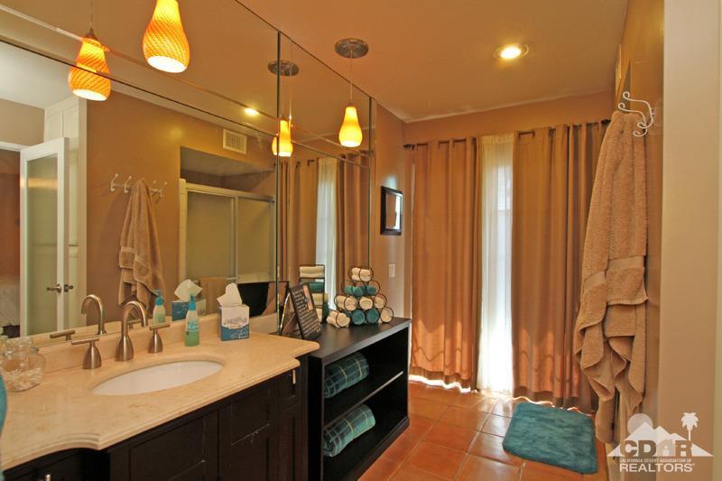4 Kevin Lee Lane Rancho Mirage, CA 92270 - Photo 31 of 53 a bathroom with a double vanity sink mirror and shower