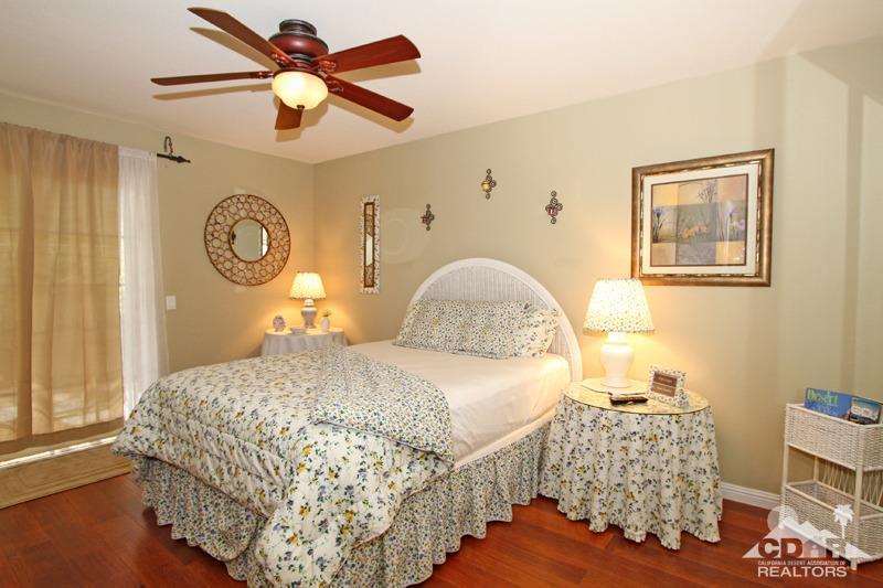 4 Kevin Lee Lane Rancho Mirage, CA 92270 - Photo 33 of 53 a bedroom with a bed and a table in it