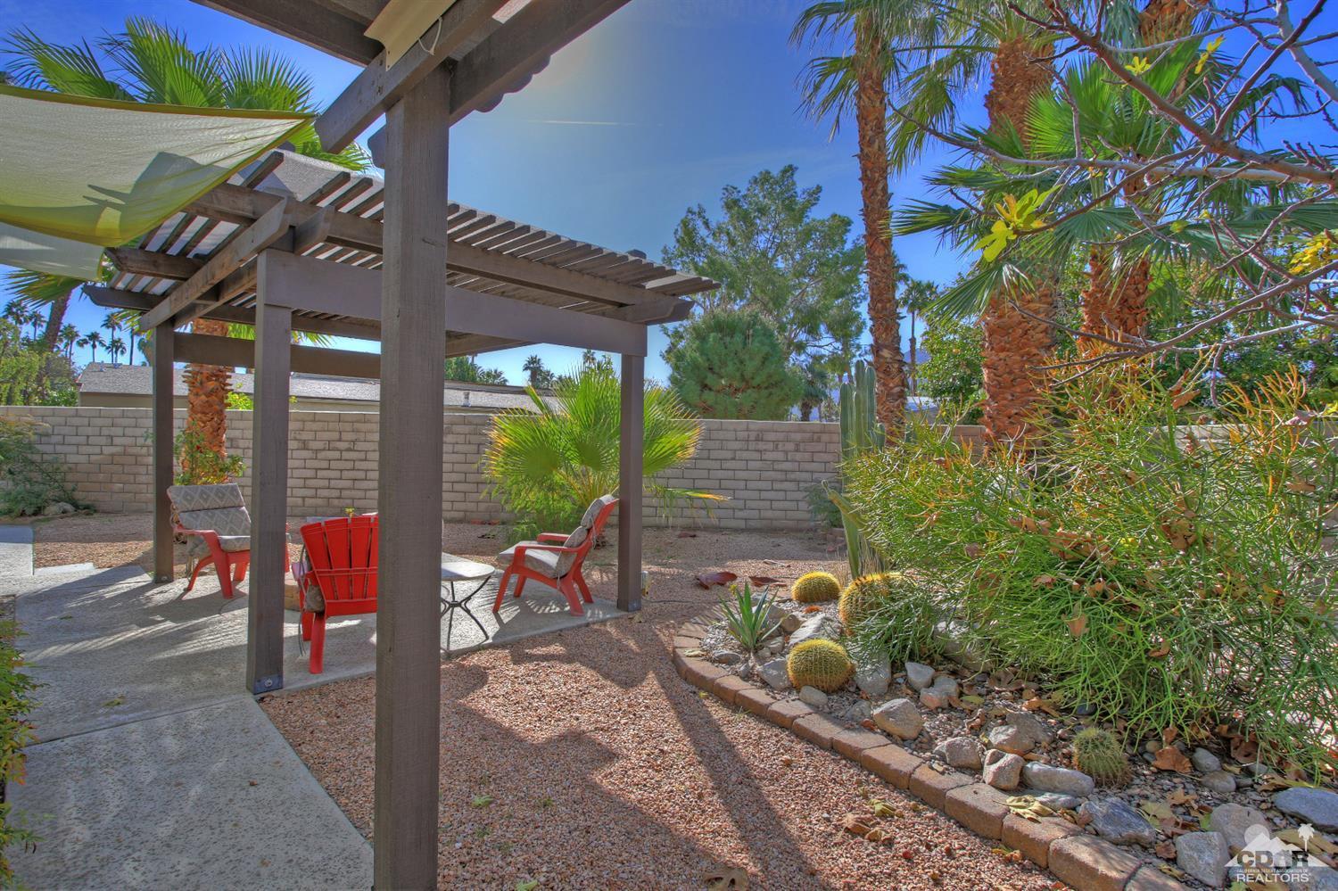 4 Kevin Lee Lane Rancho Mirage, CA 92270 - Photo 41 of 53 a patio with table and chairs and potted plants