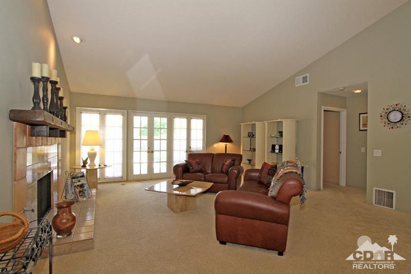 4 Kevin Lee Lane Rancho Mirage, CA 92270 - Photo 5 of 53 a living room with furniture fireplace and a large window
