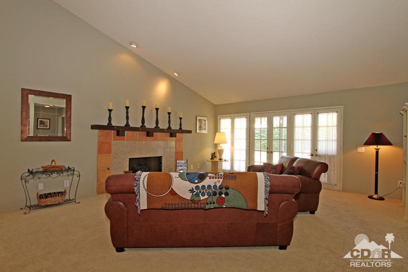 4 Kevin Lee Lane Rancho Mirage, CA 92270 - Photo 6 of 53 a living room with furniture fireplace and a large window
