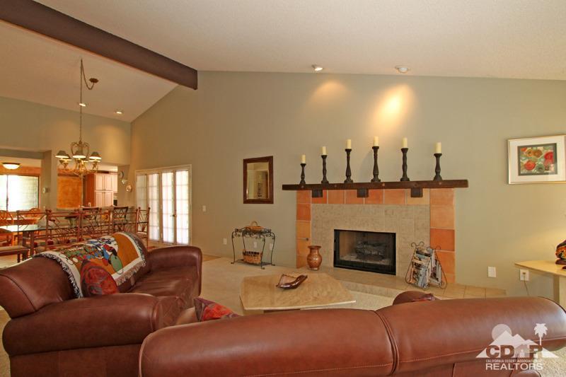 4 Kevin Lee Lane Rancho Mirage, CA 92270 - Photo 7 of 53 a living room with furniture a fireplace and a flat screen tv