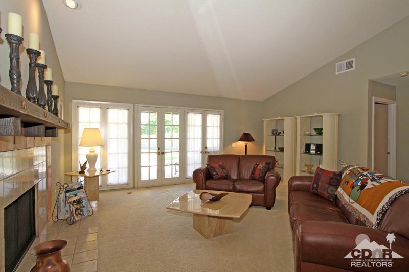 4 Kevin Lee Lane Rancho Mirage, CA 92270 - Photo 9 of 53 a living room with furniture and a flat screen tv