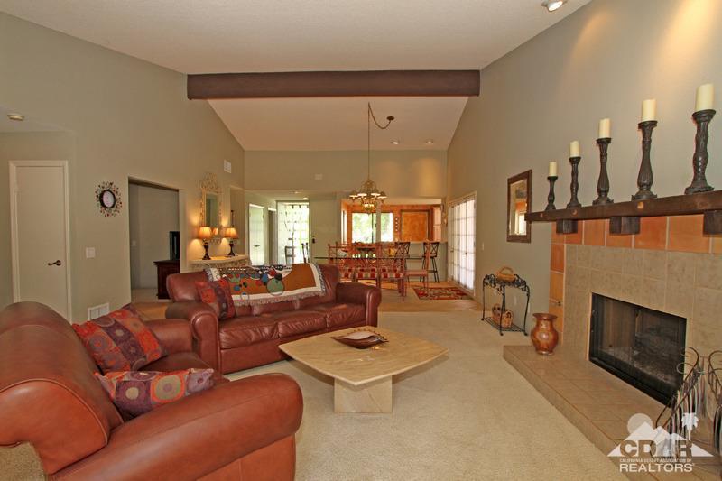 4 Kevin Lee Lane Rancho Mirage, CA 92270 - Photo 10 of 53 a living room with furniture a fireplace and a flat screen tv