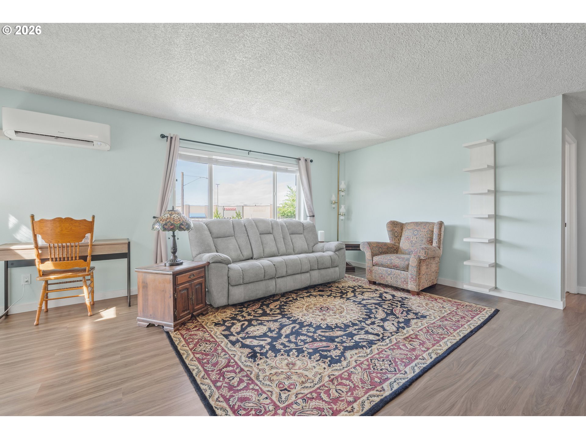 2727 Gateway Street, Unit 18 Springfield, OR 97477 - Photo 7 of 34 a living room with furniture and a rug