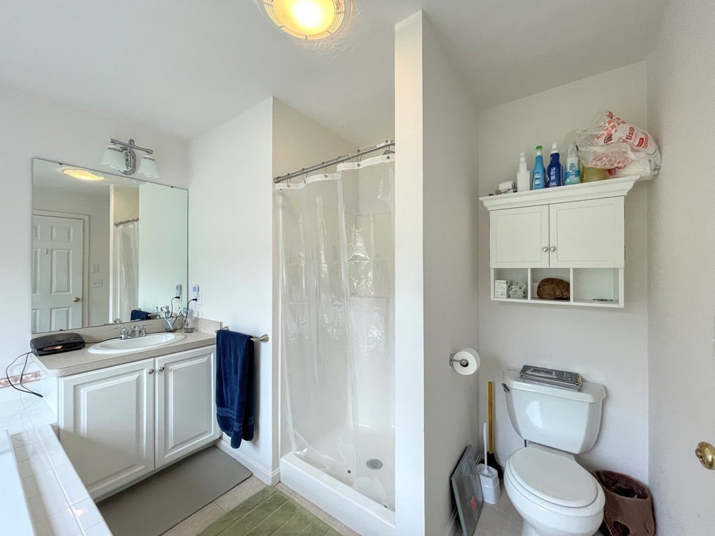 149 Groton Road Shirley, MA 01464 - Photo 18 of 32 a bathroom with a toilet sink and mirror