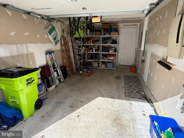 a living room with furniture and a mirror