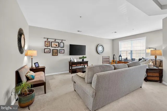 a bedroom with a bed couch and window