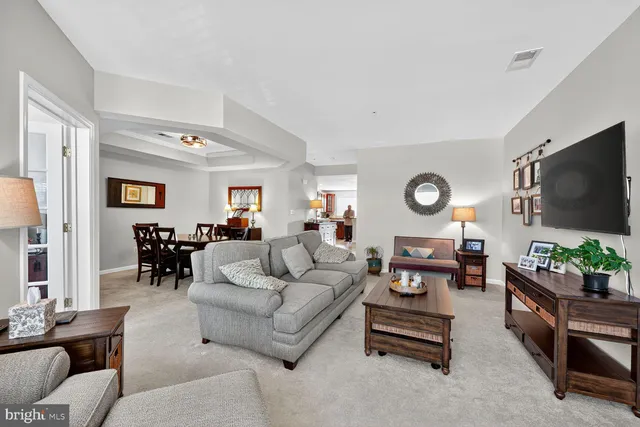 a view of walk in closet with clothes