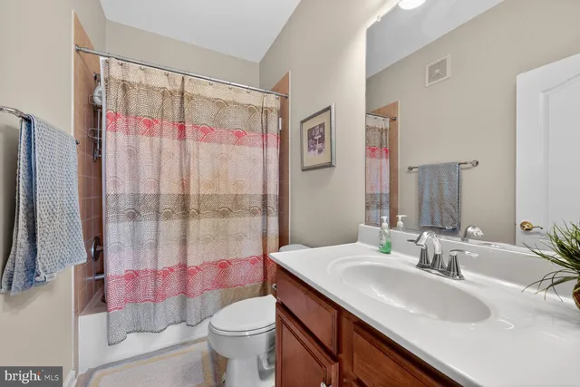 a view of a field of grass and trees