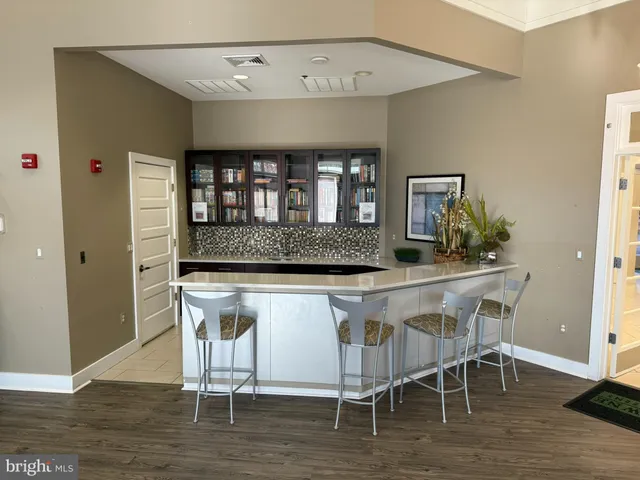 a swimming pool with outdoor seating and yard