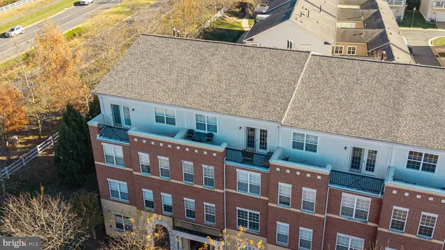 a large kitchen with a large counter top furniture and stainless steel appliances