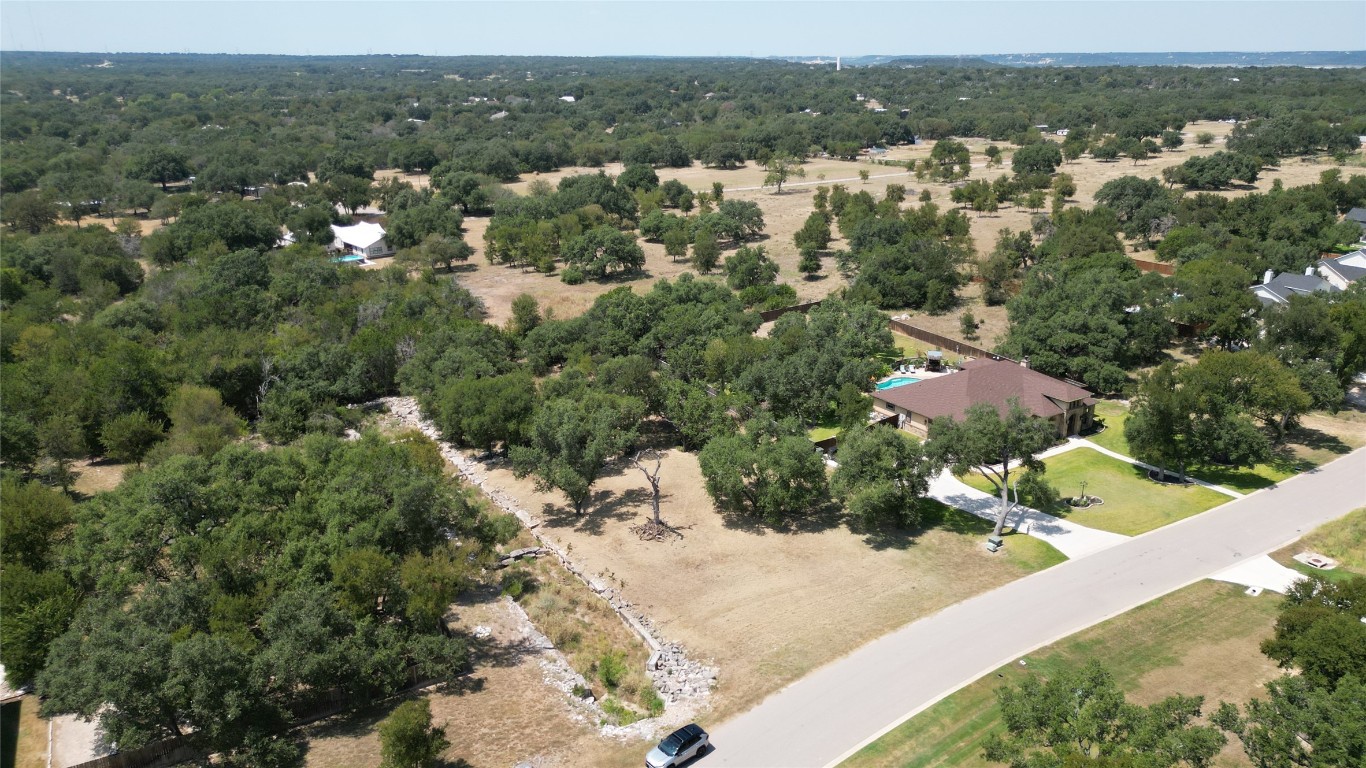 8378 Spring Creek Loop Salado, TX 76571 - Photo 13 of 13 an aerial view of residential houses with outdoor space and trees