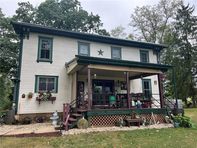 a front view of a house with porch