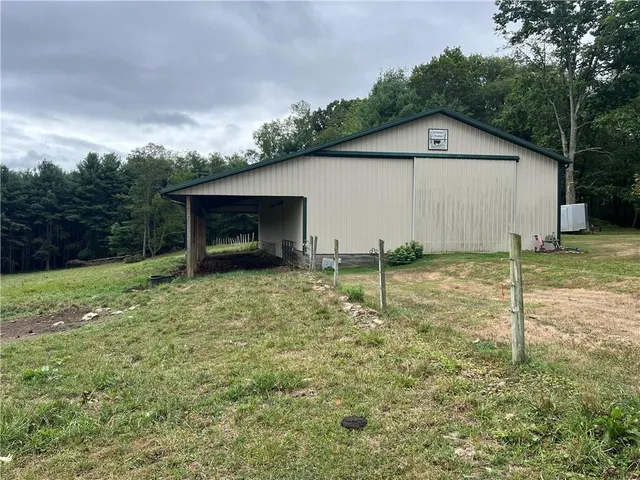a backyard of a house with lots of green space