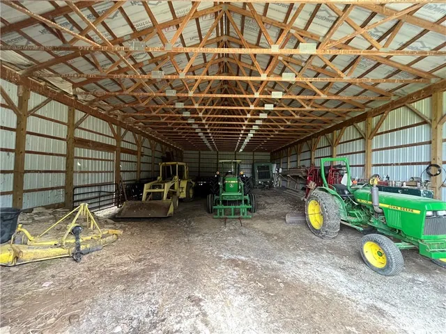 a view of a garage with parked cars