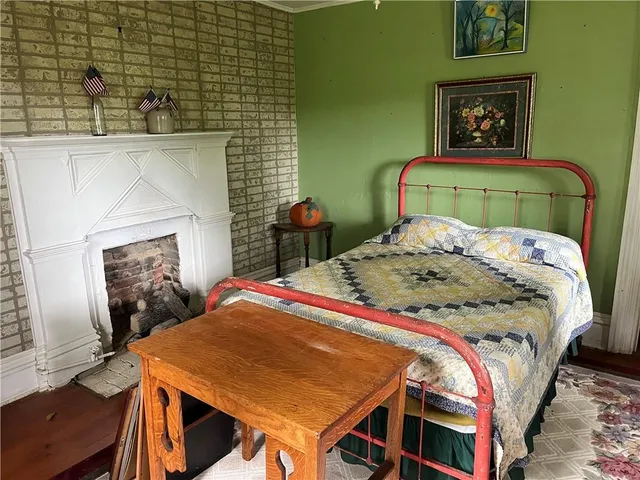 a bedroom with a bed and a table