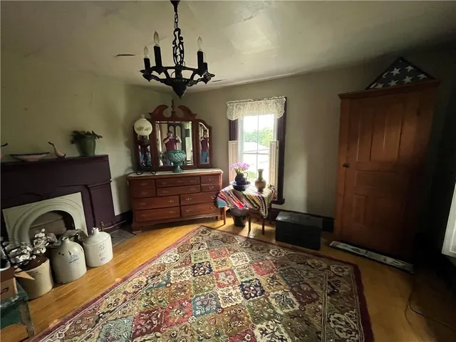 a living room with fireplace furniture and decor