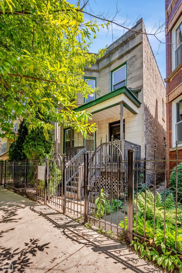 3519 West Belden Avenue Chicago, IL 60647 - Photo 1 of 1 a front view of a house with a tree