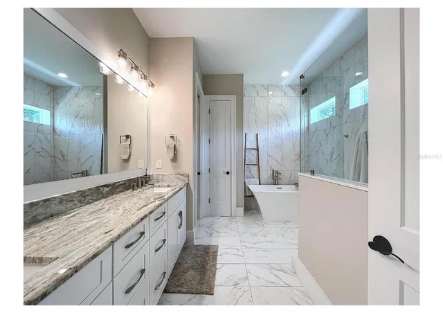 a view of living room with furniture and a rug
