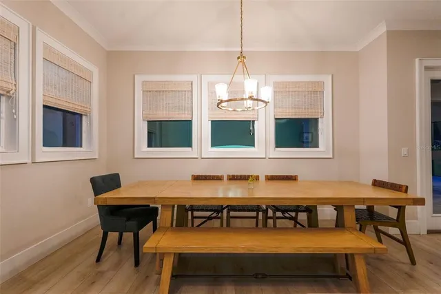 an aerial view of a house with yard and outdoor seating